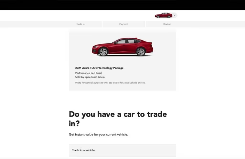A webpage showing a red 2021 Acura TLX, with an option to trade in a vehicle.